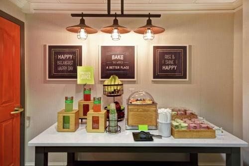 a table with a display of donuts on it at Hampton Inn Lexington I-75 in Lexington