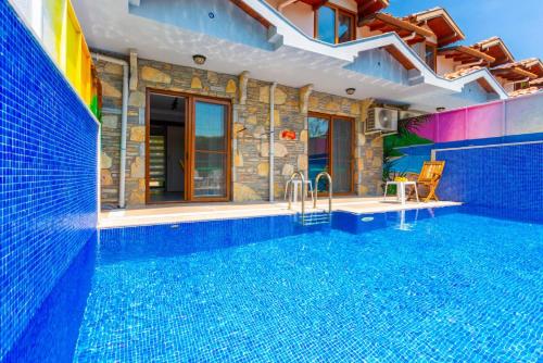 a swimming pool in a house with a swimming pool at Villa Ayla Paradise in Dalyan