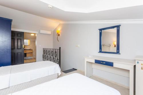 En eller flere senge i et værelse på Villa Derya Paradise