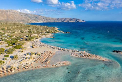 an aerial view of a beach with a resort at Neria Villas Collection in Áptera