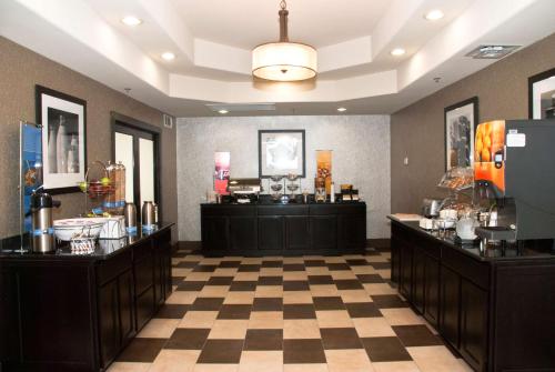 a hair salon with a checkerboard floor at Hampton Inn Maumelle in Maumelle