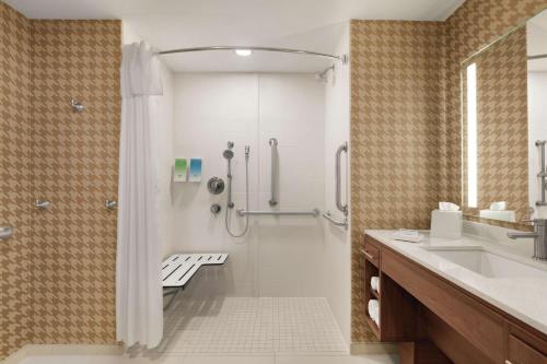 a bathroom with a shower and a sink at Home2 Suites By Hilton Lancaster in Lancaster