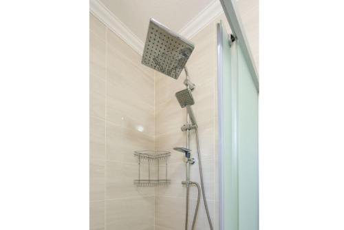 a shower with a shower head in a bathroom at Villa Veli in Dalyan