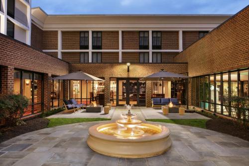 a large fountain in front of a building at DoubleTree by Hilton McLean Tysons in Tysons Corner