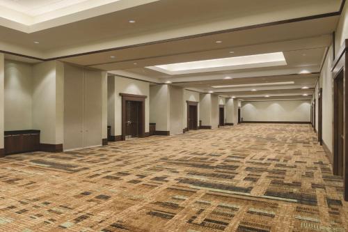 a large room with a large rug on the floor at Embassy Suites by Hilton Orlando Lake Buena Vista South in Kissimmee