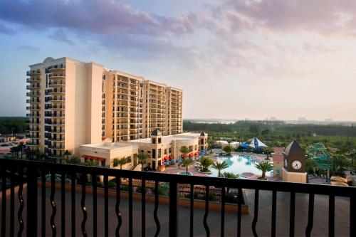 a view of a resort with a pool and buildings at Parc Soleil by Hilton Grand Vacations in Orlando