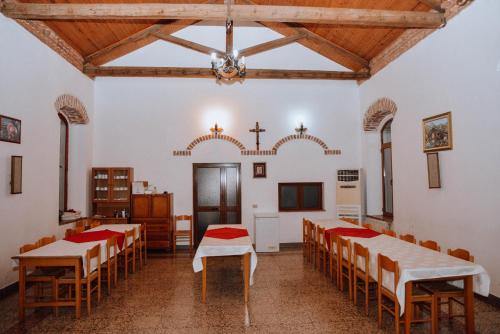 a room with tables and chairs in a church at Village of Peace - House 39 in Shkodër