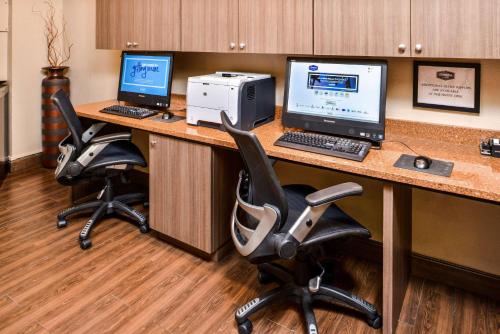 a office with two desks with two computers and a printer at Hampton Inn Closest to Universal Orlando in Orlando