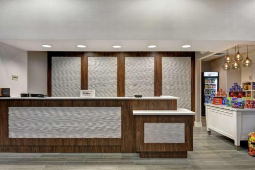 a store lobby with a counter in a store at Homewood Suites by Hilton Lake Buena Vista - Orlando in Orlando