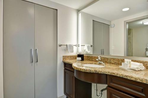 a bathroom with a sink and a shower at Homewood Suites by Hilton Lake Buena Vista - Orlando in Orlando