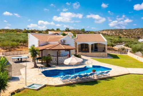 an image of a villa with a swimming pool at Villa Thea in Neo Chorio