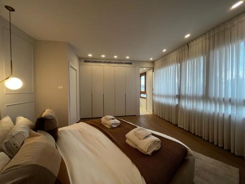 a bedroom with two towels on a bed at David Residence New Private apartment in Jerusalem