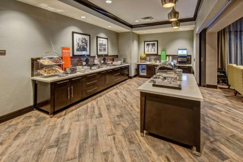 a restaurant with a buffet line with food at Hampton Inn & Suites Memphis Germantown in Memphis