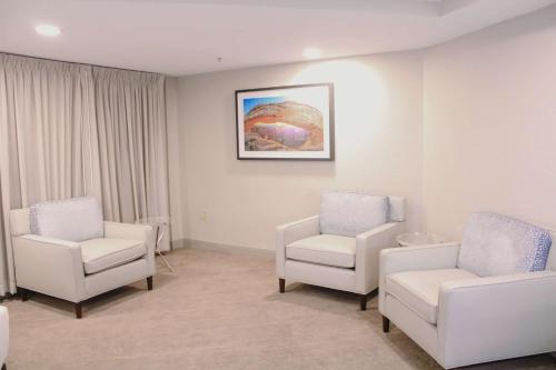 a hospital room with two chairs and a couch at Doubletree by Hilton Phoenix Mesa in Mesa