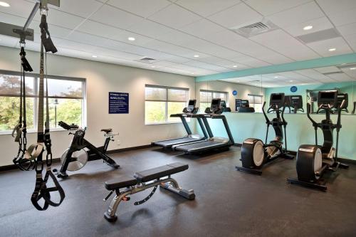 a gym with several exercise bikes and tread machines at Tru By Hilton Manchester Downtown in Manchester