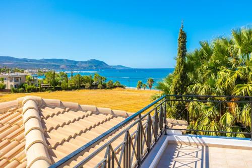 a balcony with a view of the ocean at Villa Anna in Lachi