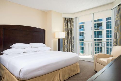 a hotel room with a bed and a window at DoubleTree by Hilton Ocean Point Resort - North Miami Beach in Miami Beach