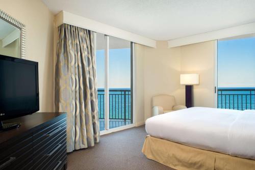 a hotel room with a bed and a large window at DoubleTree by Hilton Ocean Point Resort - North Miami Beach in Miami Beach