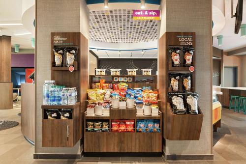 a store with a display of food and drinks at Tru By Hilton Milwaukee Brookfield in Waukesha