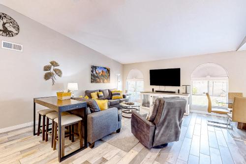a living room with a couch and a table at WeeCasa in Chandler