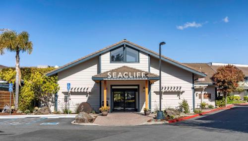 a seafood restaurant with a sign on the front of a building at Seacliff Inn Aptos, Tapestry Collection by Hilton in Aptos