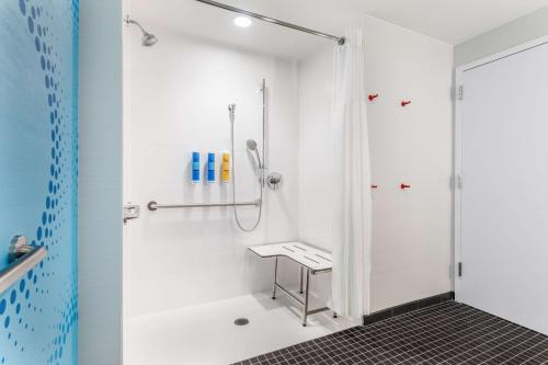 a bathroom with a shower and a sink at Tru By Hilton Madison West in Madison