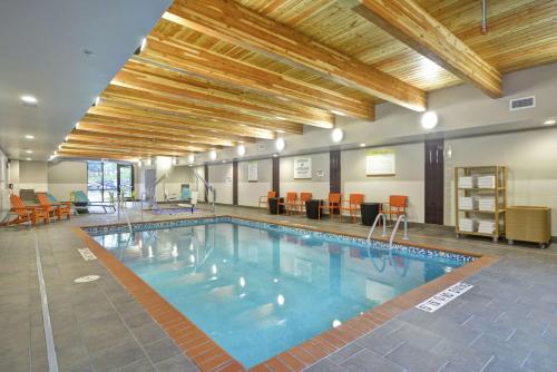 a large swimming pool in a large room with at Home2 Suites By Hilton Minneapolis-Eden Prairie in Minnetonka