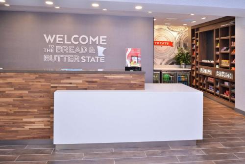 a welcome to the bread and butter store with a white counter at Hampton Inn Lakeville Minneapolis, Mn in Lakeville