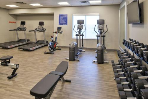 a gym with treadmills and exercise bikes in a room at Hampton Inn Lakeville Minneapolis, Mn in Lakeville