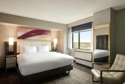 a hotel room with a bed and a window at DoubleTree by Hilton St. Paul, MN in Saint Paul