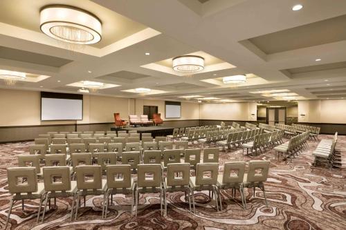 a conference room with chairs and a podium in it at Embassy Suites By Hilton Minneapolis Downtown Hotel in Minneapolis