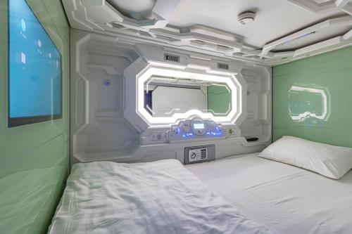 a room with a bed and a window at CAPS LOCK Future Hotel in Astana