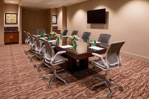 a conference room with a long table and chairs at Hilton Garden Inn Downtown Dallas in Dallas