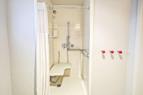 a bathroom with a shower with a sink and a toilet at Hampton Inn Miami Beach - Mid Beach in Miami Beach