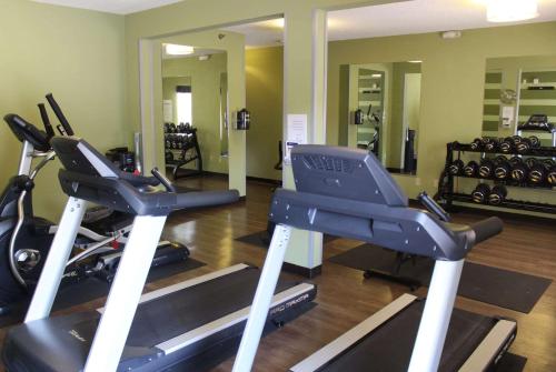 a gym with two exercise bikes and a treadmill at Wingate by Wyndham Savannah I-95 North in Port Wentworth