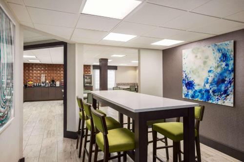 a conference room with a table and chairs at Wingate by Wyndham Savannah I-95 North in Port Wentworth
