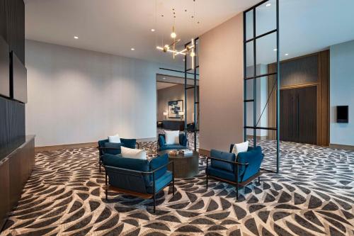 a lobby with two chairs and a waiting room at Hyatt Regency Baytown-Houston in Baytown