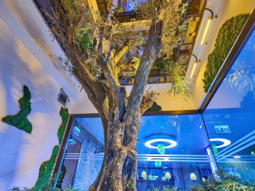 a tree in the middle of a building at Ibis Istanbul Airport in Istanbul