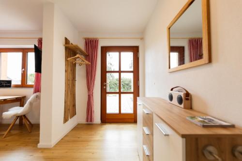 a kitchen with a wooden counter and a mirror at Chalet Winterberg in Winterberg