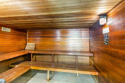an empty sauna with wooden walls and wooden benches at Comfort Inn & Suites in Rapid City