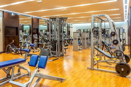 a gym with a bunch of equipment in it at Radisson Blu Hotel & Resort, Sohar in Sohar