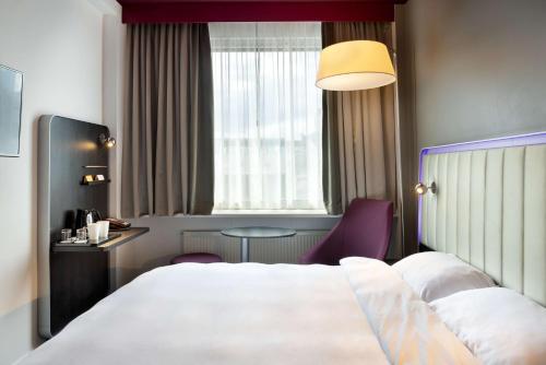 Voodi või voodid majutusasutuse Park Inn by Radisson Central Tallinn toas