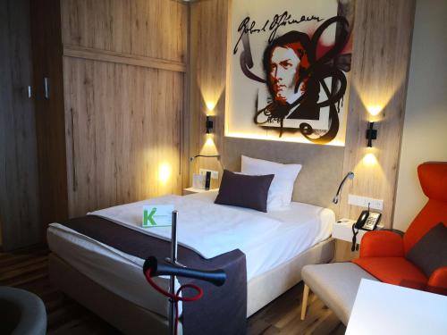 Una cama o camas en una habitación de First Inn Hotel Zwickau
