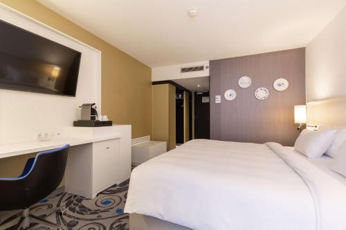 Ένα ή περισσότερα κρεβάτια σε δωμάτιο στο Radisson Blu Hotel, Amsterdam City Center