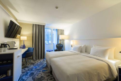 Ένα ή περισσότερα κρεβάτια σε δωμάτιο στο Radisson Blu Hotel, Amsterdam City Center