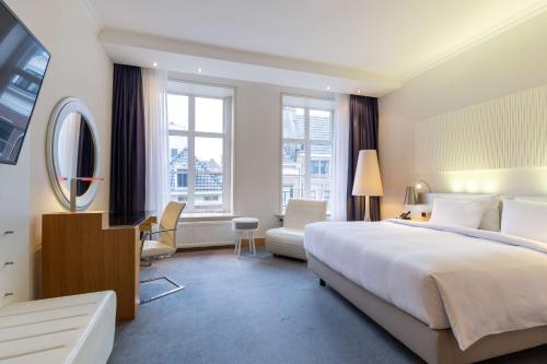 Ένα ή περισσότερα κρεβάτια σε δωμάτιο στο Radisson Blu Hotel, Amsterdam City Center