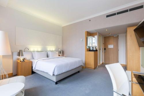 Ένα ή περισσότερα κρεβάτια σε δωμάτιο στο Radisson Blu Hotel, Amsterdam City Center