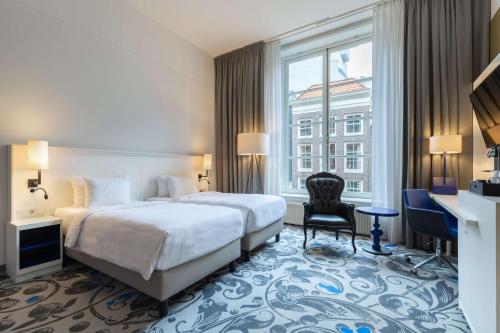 Ένα ή περισσότερα κρεβάτια σε δωμάτιο στο Radisson Blu Hotel, Amsterdam City Center