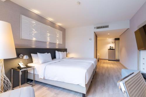 Ένα ή περισσότερα κρεβάτια σε δωμάτιο στο Radisson Blu Hotel, Amsterdam City Center
