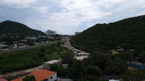 a view of a road between two mountains at Lindo apartamento en Santa Marta, Rodadero, Gaira 503 in Santa Marta